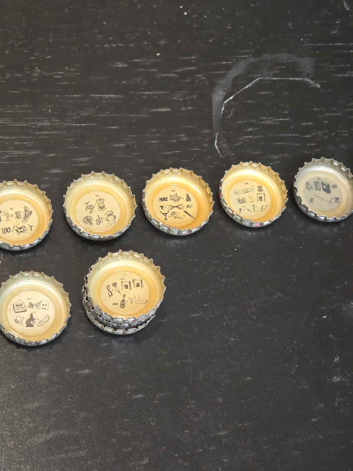 Set of 122 Lucky Lager Rebus/Puzzle Bottle Caps - Silver w/ Red Script