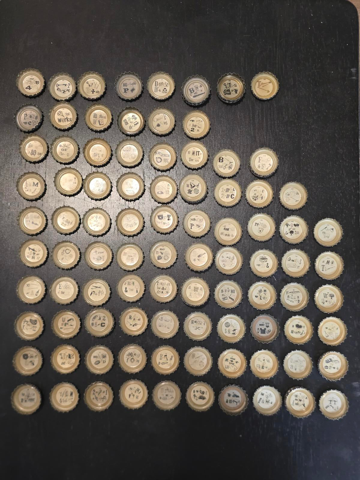 Set of 122 Lucky Lager Rebus/Puzzle Bottle Caps - Silver w/ Red Script
