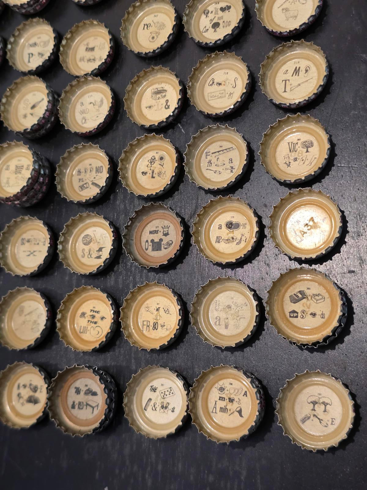 Set of 122 Lucky Lager Rebus/Puzzle Bottle Caps - Silver w/ Red Script