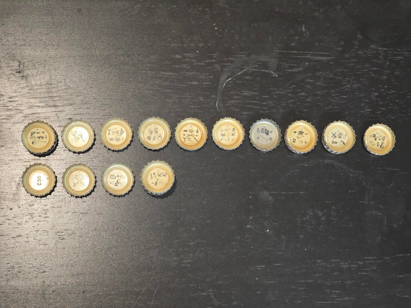 Set of 122 Lucky Lager Rebus/Puzzle Bottle Caps - Silver w/ Red Script