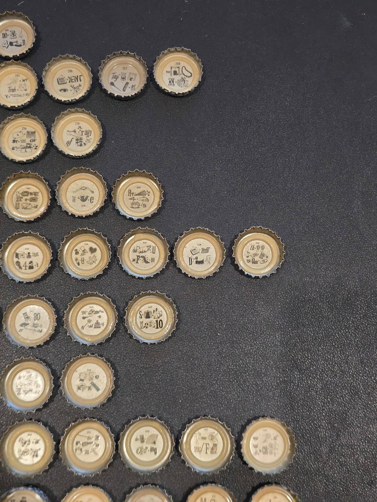 Set of 76 Lucky Lager Rebus/Puzzle Bottle Caps - Silver w/ Red Script