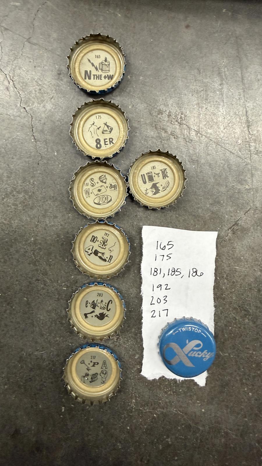 Set of 10 Lucky Lager Rebus/Puzzle Bottle Caps - Blue & Silver