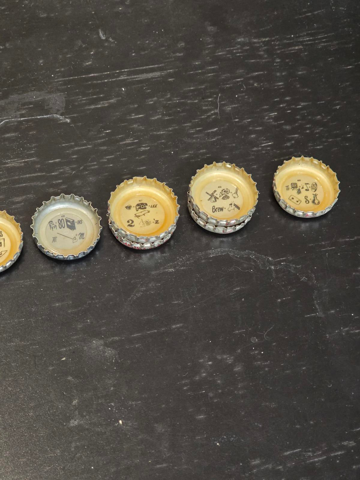 Set of 122 Lucky Lager Rebus/Puzzle Bottle Caps - Silver w/ Red Script