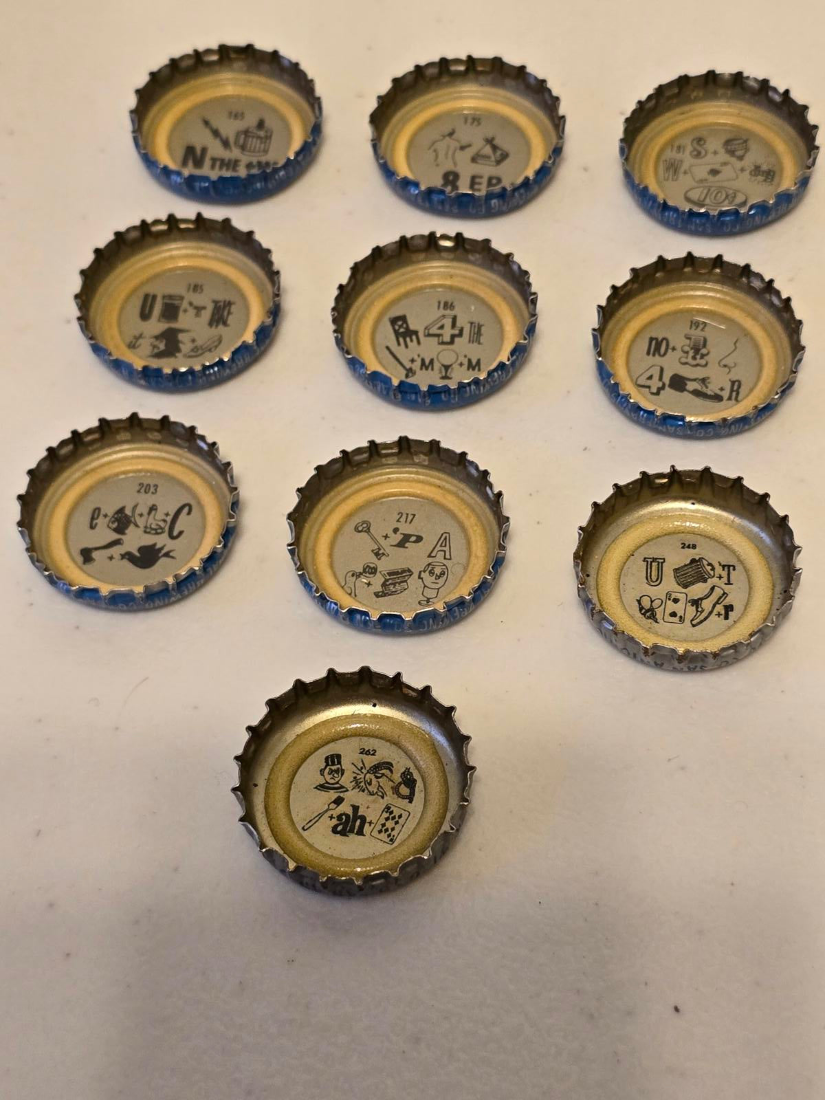 Set of 10 Lucky Lager Rebus/Puzzle Bottle Caps - Blue & Silver