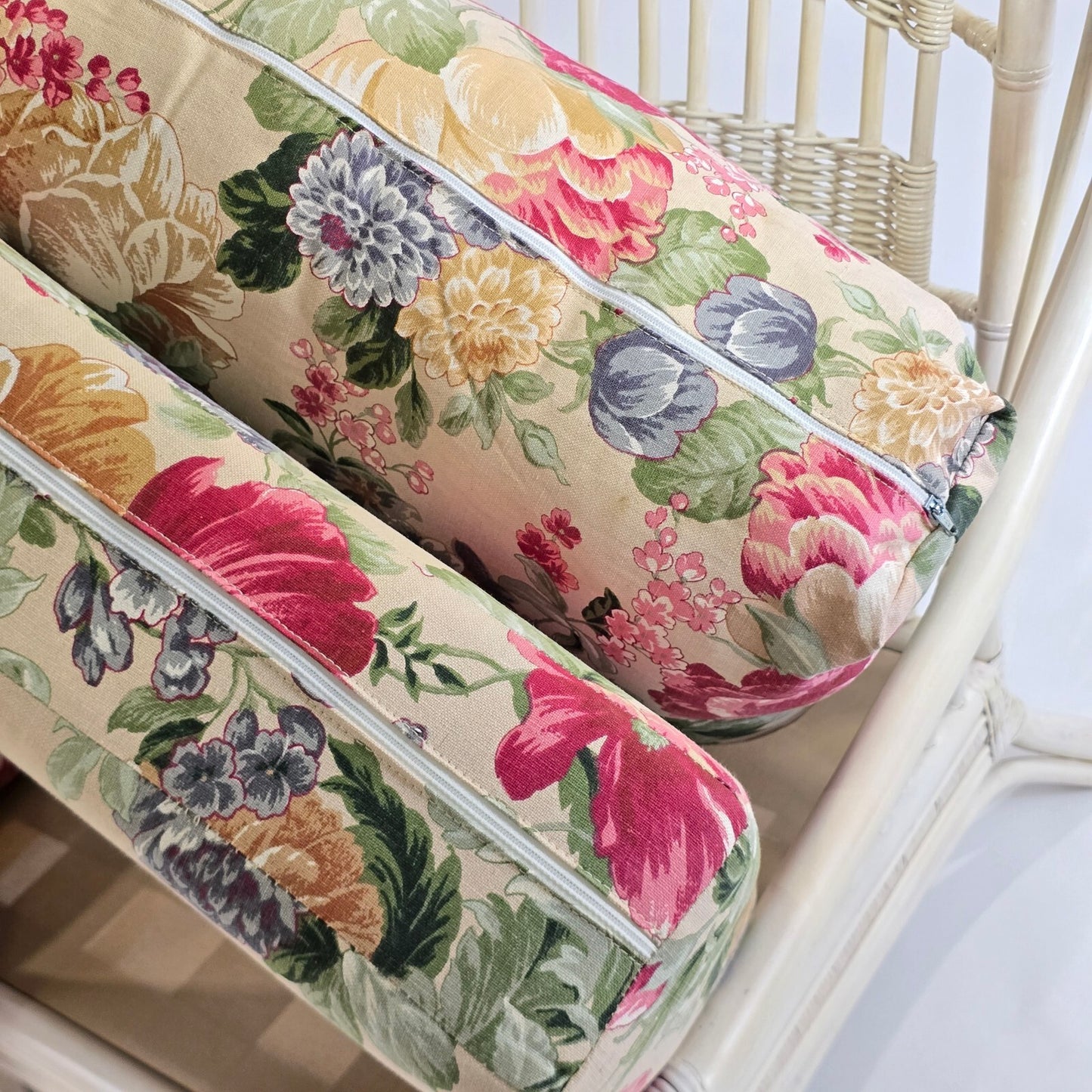 Whitewashed Rattan Sofa with Floral Cushions