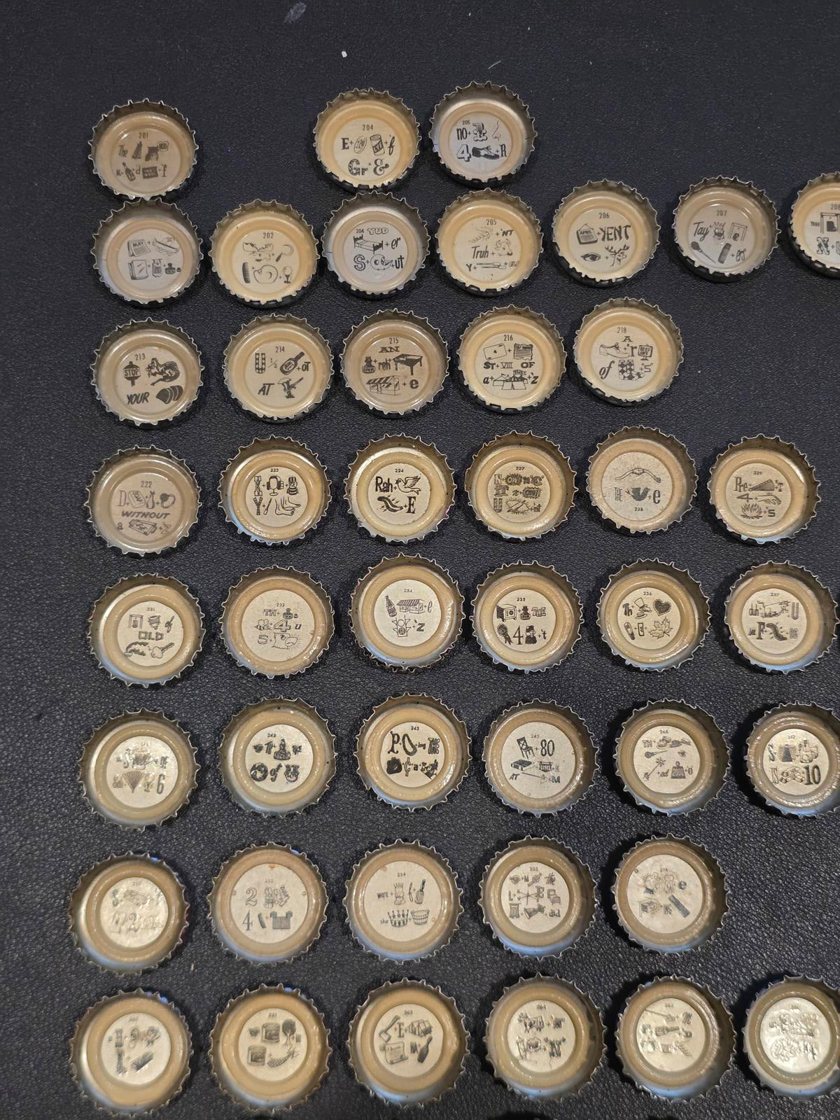 Set of 76 Lucky Lager Rebus/Puzzle Bottle Caps - Silver w/ Red Script